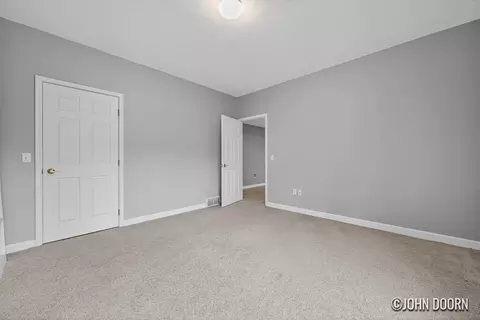 Bedroom - 57 Rollingbrook Dr NE, Ada, MI 49301 photo 1 of 7