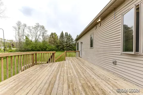 Exterior - 57 Rollingbrook Dr NE, Ada, MI 49301 photo 2 of 3