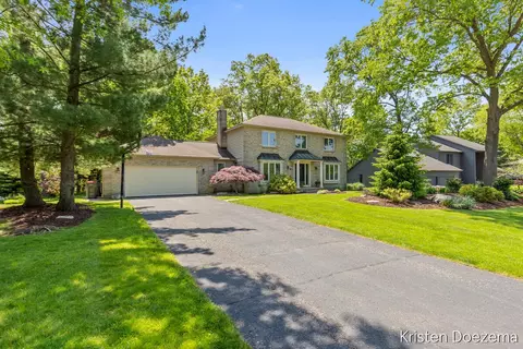Exterior - 7716 Kirkwall Dr SE, Ada, MI 49301 photo 2 of 6