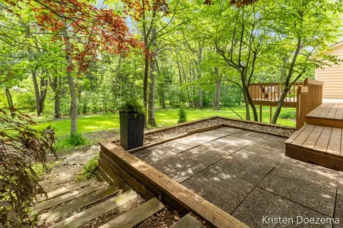 Exterior - 7716 Kirkwall Dr SE, Ada, MI 49301 photo 4 of 6