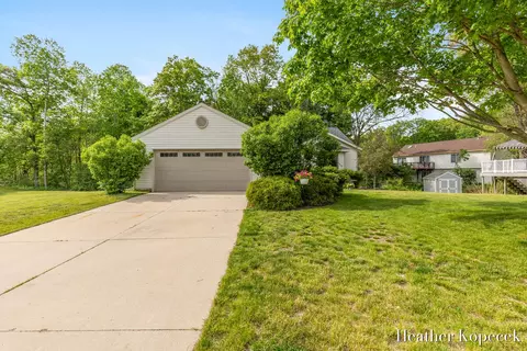 Exterior - 1663 Barnsley Ct SE, Lowell, MI 49331 photo 2 of 7