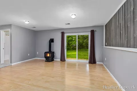 Living - 1663 Barnsley Ct SE, Lowell, MI 49331 photo 4 of 5