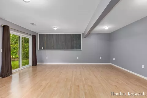Living - 1663 Barnsley Ct SE, Lowell, MI 49331 photo 3 of 5