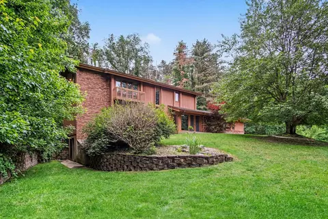 Exterior - 540 Roundtree Dr NE, Ada, MI 49301 photo 2 of 6
