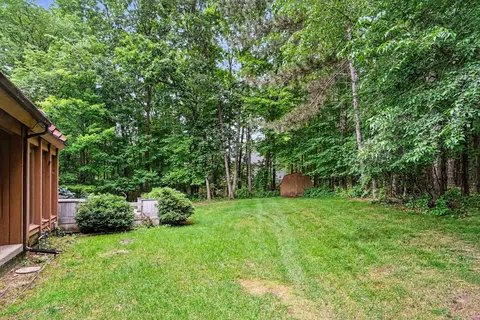 Exterior - 540 Roundtree Dr NE, Ada, MI 49301 photo 4 of 6