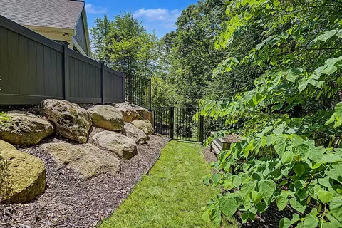 Exterior - 547 Roundtree Dr NE, Ada, MI 49301 photo 16 of 24