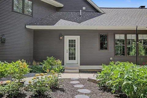 Exterior - 547 Roundtree Dr NE, Ada, MI 49301 photo 10 of 24