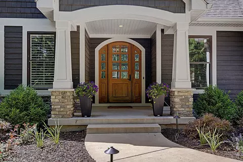 Exterior - 547 Roundtree Dr NE, Ada, MI 49301 photo 3 of 24