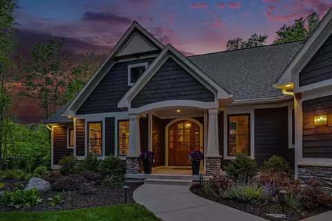 Exterior - 547 Roundtree Dr NE, Ada, MI 49301 photo 21 of 24