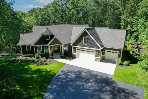 Exterior - 547 Roundtree Dr NE, Ada, MI 49301 photo 6 of 24