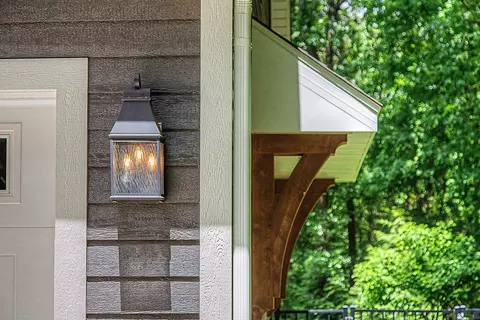 Exterior - 547 Roundtree Dr NE, Ada, MI 49301 photo 5 of 24