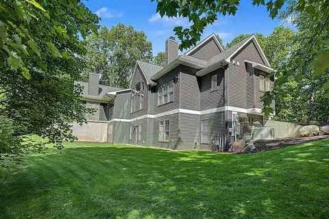Exterior - 547 Roundtree Dr NE, Ada, MI 49301 photo 19 of 24