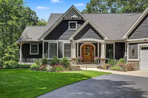 Exterior - 547 Roundtree Dr NE, Ada, MI 49301 photo 2 of 24