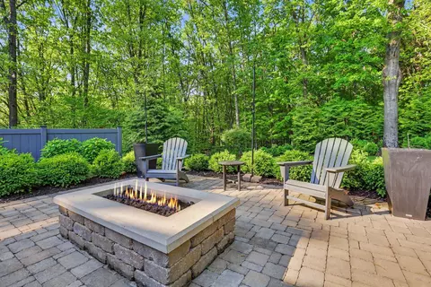 Exterior - 547 Roundtree Dr NE, Ada, MI 49301 photo 11 of 24