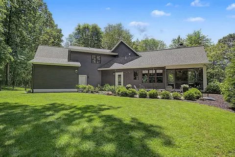 Exterior - 547 Roundtree Dr NE, Ada, MI 49301 photo 8 of 24