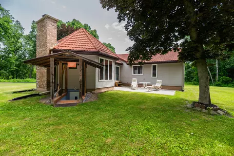 Exterior - 989 Mccabe Ave NE, Ada, MI 49301 photo 3 of 13