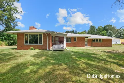 Exterior - 311 Honey Creek Ave SE, Ada, MI 49301 photo 4 of 7