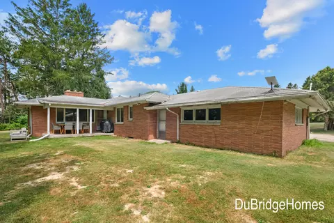 Exterior - 311 Honey Creek Ave SE, Ada, MI 49301 photo 2 of 7
