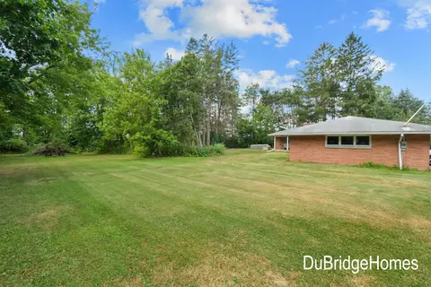 Exterior - 311 Honey Creek Ave SE, Ada, MI 49301 photo 1 of 7