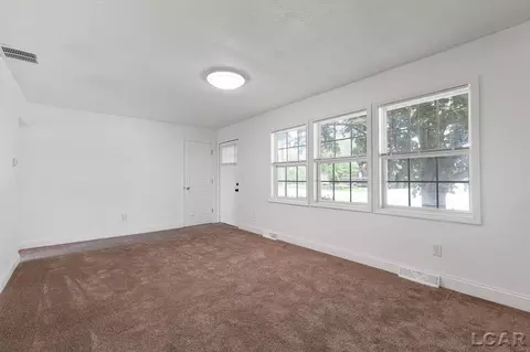Living - 1130 Lowe, Adrian, MI 49221 photo 4 of 7