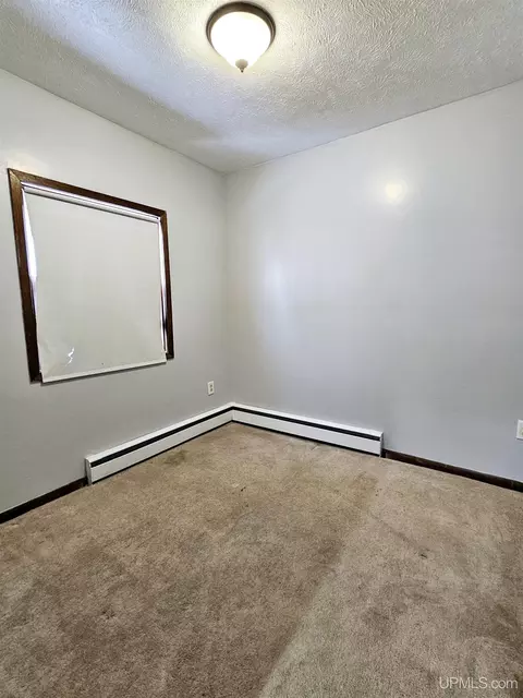 Bedroom - 516 S 10th, Escanaba, MI 49829 photo 2 of 3