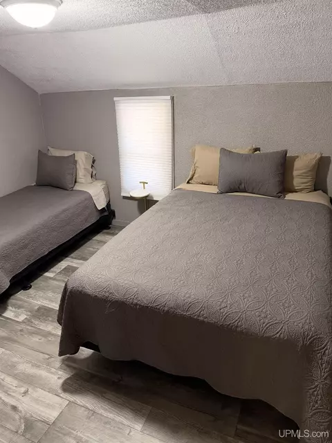 Bedroom - e9399 Michigan 28, Munising, MI 49862 photo 6 of 8
