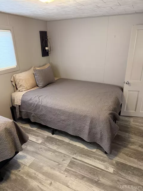 Bedroom - e9399 Michigan 28, Munising, MI 49862 photo 2 of 8