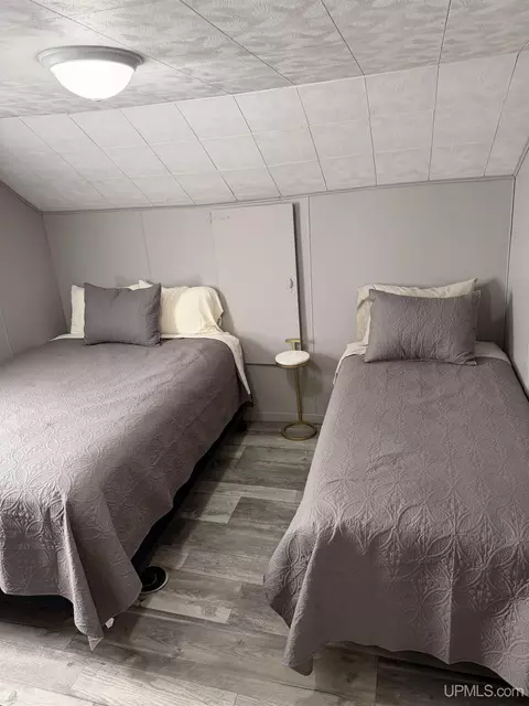Bedroom - e9399 Michigan 28, Munising, MI 49862 photo 7 of 8