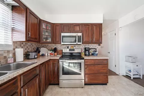 Kitchen - 107 Renfrew, Adrian, MI 49221 photo 2 of 3