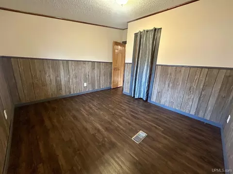 Bedroom - e9574 Prospect Street, Munising, MI 49862 photo 3 of 5
