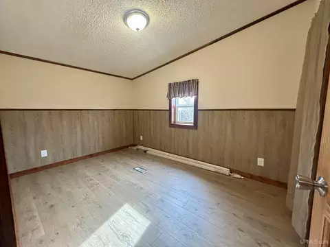 Bedroom - e9574 Prospect Street, Munising, MI 49862 photo 4 of 5