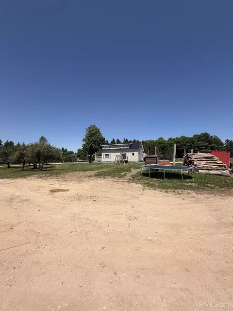 Exterior - 6980 E Ln, Bark River, MI 49807 photo 9 of 16