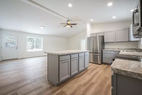 Living - 1208 Pheasant Run, Gladwin, MI 48624 photo 5 of 7