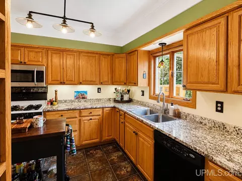 Kitchen - 828 Michigan St, Ishpeming, MI 49849 photo 2 of 3