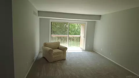 Living - 5400 Maple Rdg #15, Haslett, MI 48840 photo 2 of 2