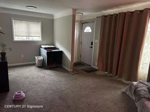 Living - 1814 Marlowe Dr, Flint, MI 48504 photo 2 of 2