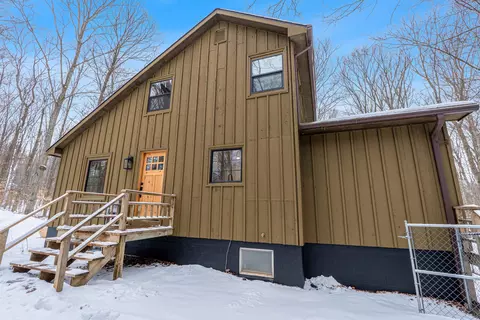 Exterior - 828 E Sullivan Woods, Cedar, MI 49621 photo 4 of 6