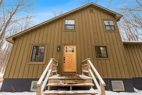 Exterior - 828 E Sullivan Woods, Cedar, MI 49621 photo 5 of 6