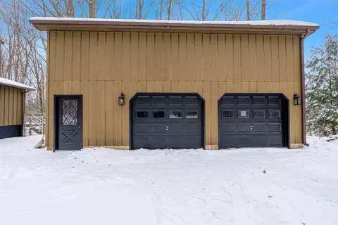 Exterior - 828 E Sullivan Woods, Cedar, MI 49621 photo 3 of 6