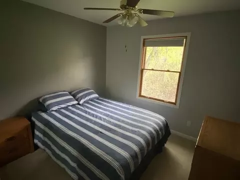 Bedroom - 10200 Riley, Interlochen, MI 49643 photo 2 of 3