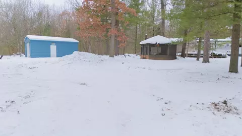 Exterior - 7467 E Higgins Lk, Roscommon, MI 48653 photo 3 of 8