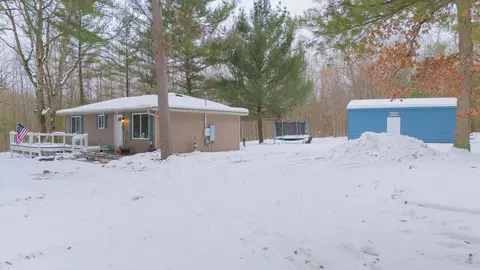 Exterior - 7467 E Higgins Lk, Roscommon, MI 48653 photo 2 of 8