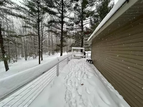 Exterior - 7467 E Higgins Lk, Roscommon, MI 48653 photo 4 of 8