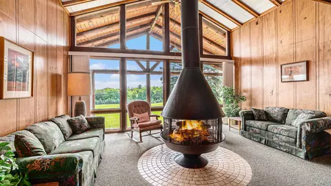 Living - 5665 M-33, Comins, MI 48619 photo 1 of 3