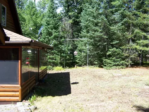 Exterior - 308 Ausable River Trl, Roscommon, MI 48653 photo 10 of 15