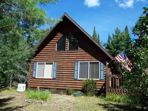Exterior - 308 Ausable River Trl, Roscommon, MI 48653 photo 2 of 15