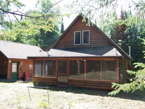 Exterior - 308 Ausable River Trl, Roscommon, MI 48653 photo 9 of 15