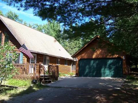 Exterior - 308 Ausable River Trl, Roscommon, MI 48653 photo 4 of 15