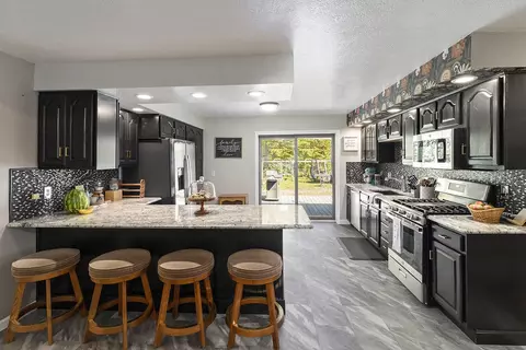 Kitchen - 2371 E Mullett Lake Rd, Indian River, MI 49749 photo 3 of 5