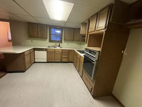 Kitchen - 101 E Sunset Dr, Roscommon, MI 48653 photo 1 of 2